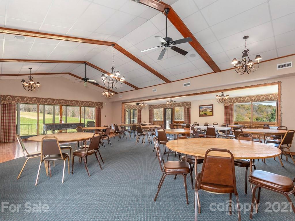 566 Walker Road Waynesville, NC 28786 - Photo 6 of 28 a dining room with lots of tables and chairs