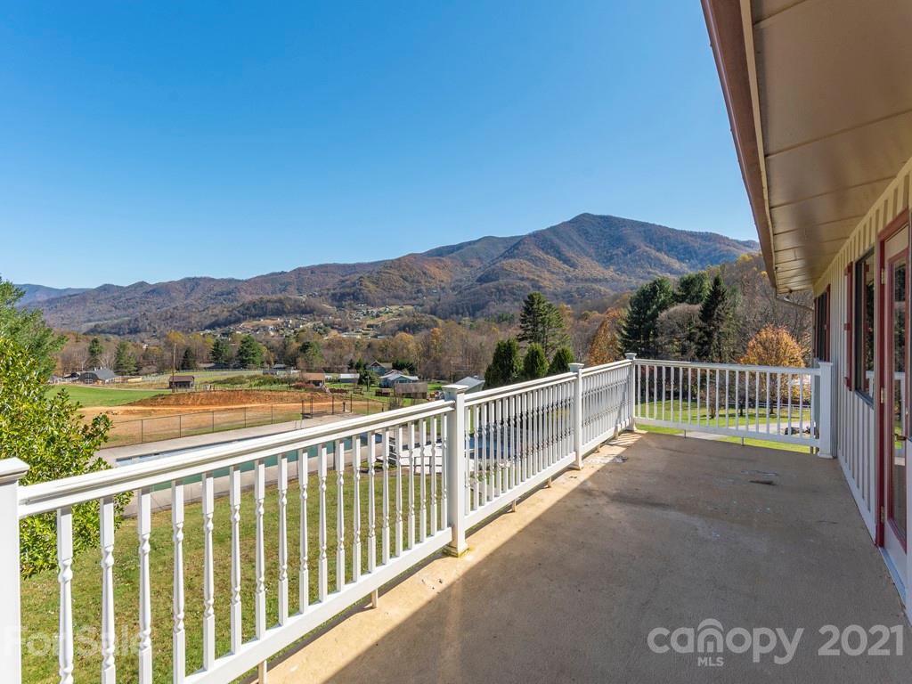 566 Walker Road Waynesville, NC 28786 - Photo 9 of 28 a view of a balcony with a yard