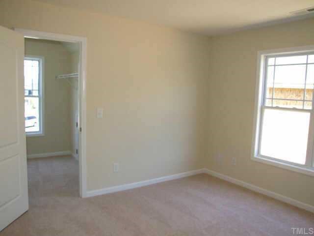 4045 Patriot Ridge Court Raleigh, NC 27610 - Photo 7 of 7 an empty room with a window