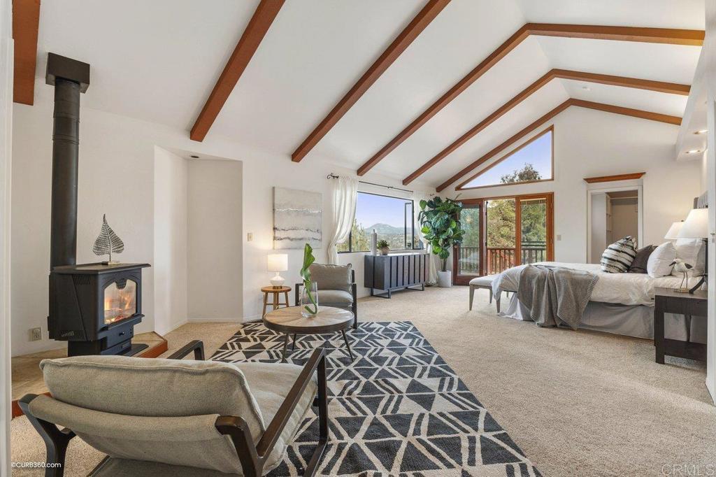 602 Sereno View Road Encinitas, CA 92024 - Photo 16 of 56 a living room with furniture and a floor to ceiling window