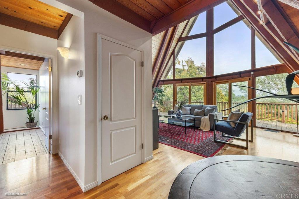 602 Sereno View Road Encinitas, CA 92024 - Photo 23 of 56 Main floor living room leading to third bedroom and kitchen