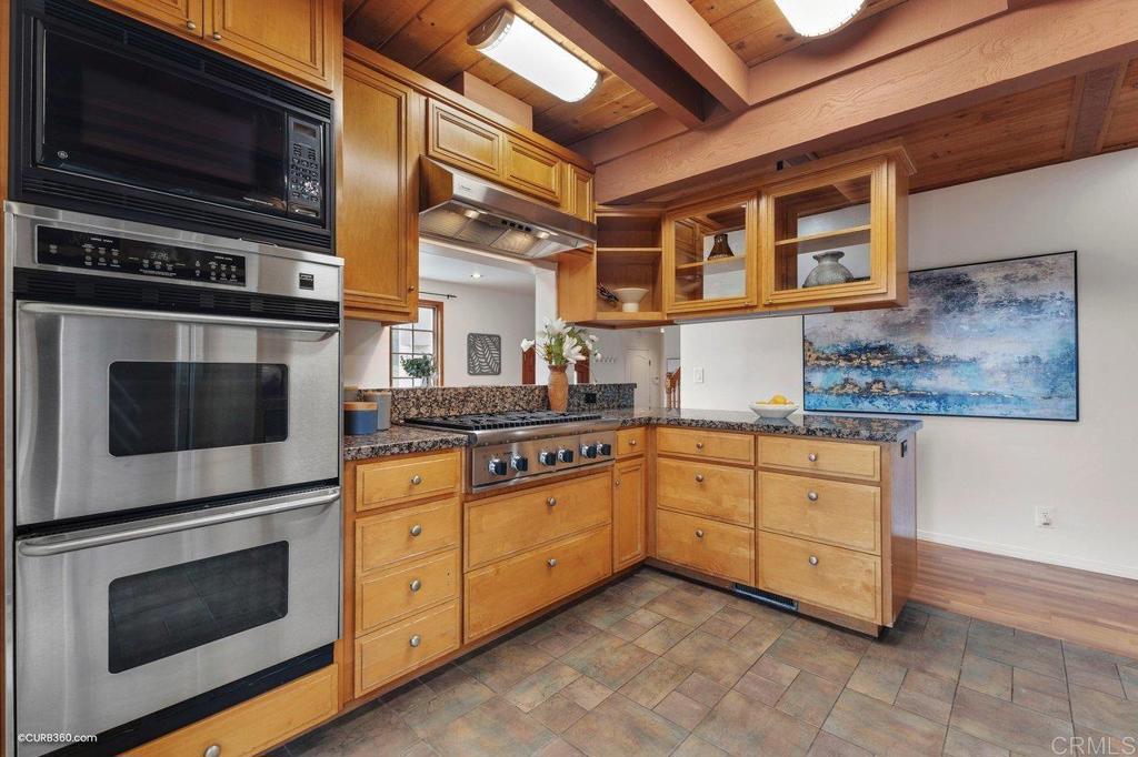 602 Sereno View Road Encinitas, CA 92024 - Photo 25 of 56 a kitchen with stainless steel appliances granite countertop a stove and a microwave