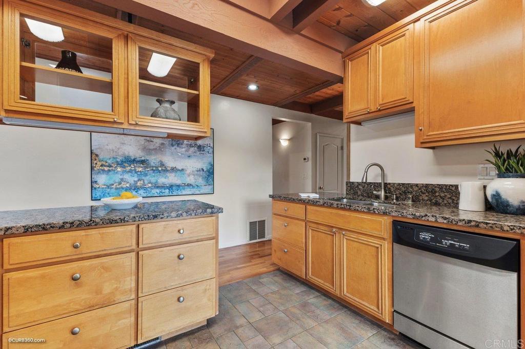 602 Sereno View Road Encinitas, CA 92024 - Photo 26 of 56 a kitchen with granite countertop cabinets stainless steel appliances and a counter space