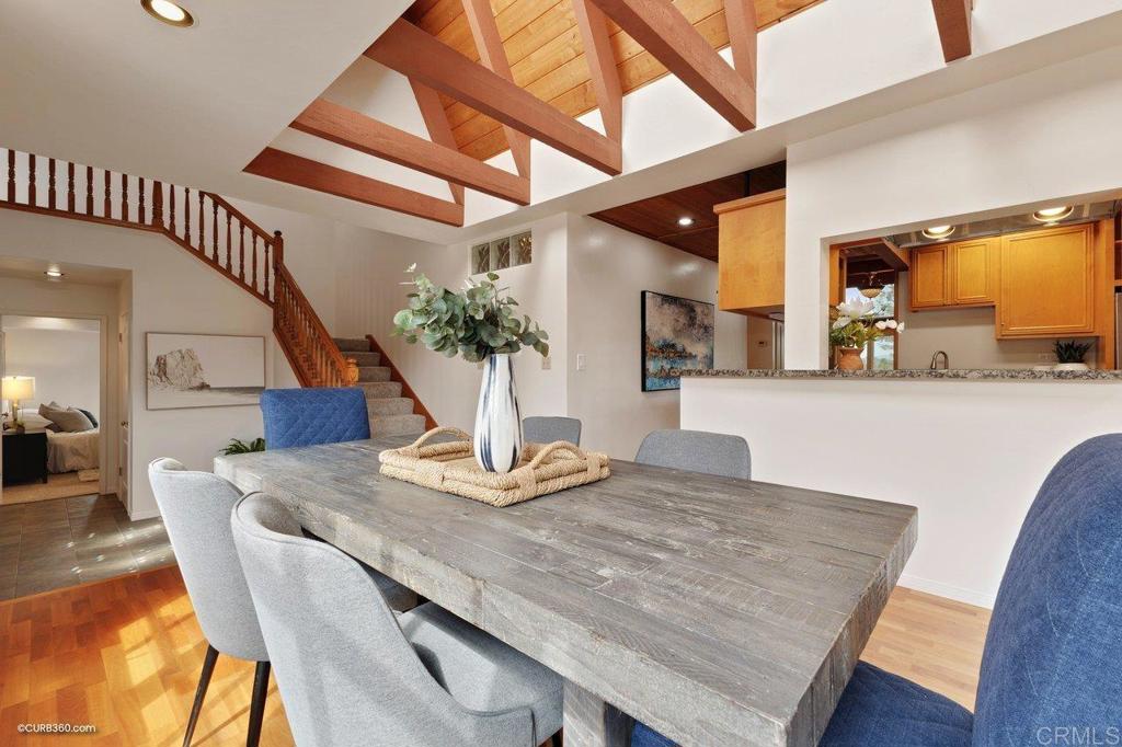 602 Sereno View Road Encinitas, CA 92024 - Photo 28 of 56 a dining room with furniture and wooden floor