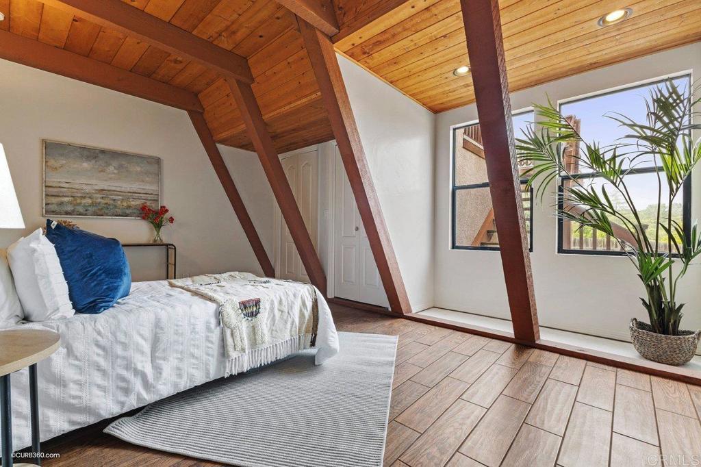 602 Sereno View Road Encinitas, CA 92024 - Photo 35 of 56 a bedroom with a bed and a potted plant