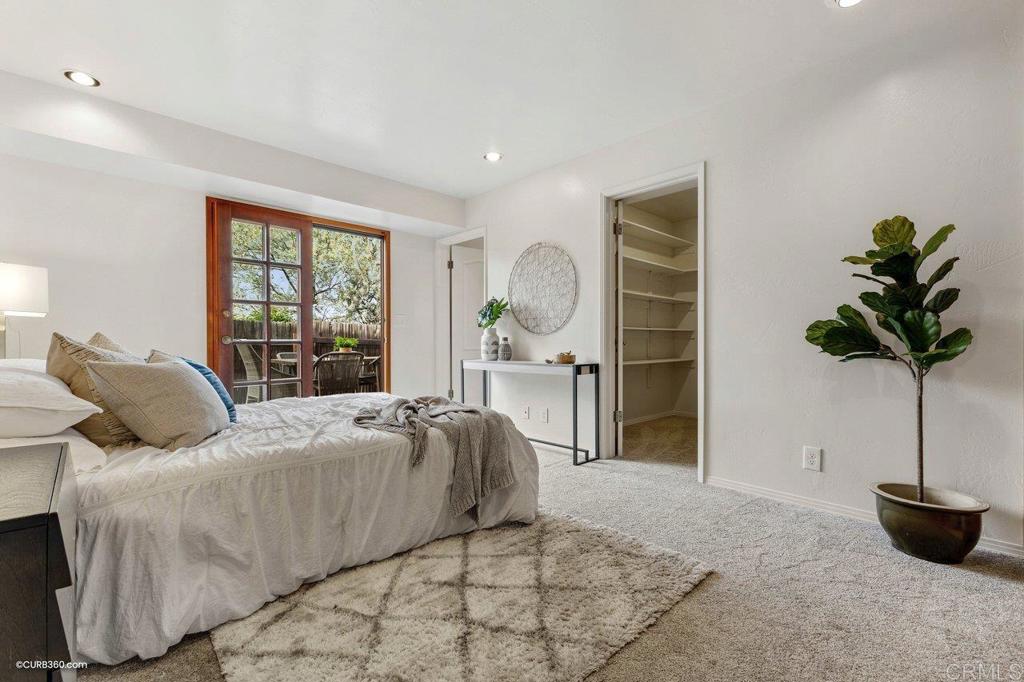 602 Sereno View Road Encinitas, CA 92024 - Photo 36 of 56 a bed sitting in a bedroom next to a window and a potted plant