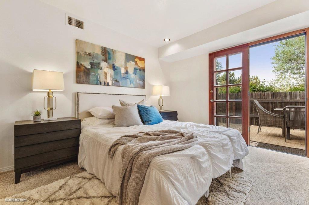 602 Sereno View Road Encinitas, CA 92024 - Photo 40 of 56 a bedroom with a bed and a large window