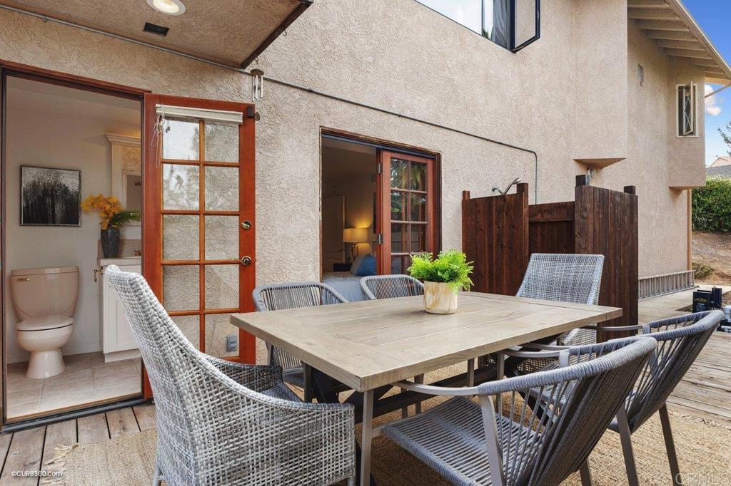 602 Sereno View Road Encinitas, CA 92024 - Photo 41 of 56 a view of a dining room with furniture window and wooden floor