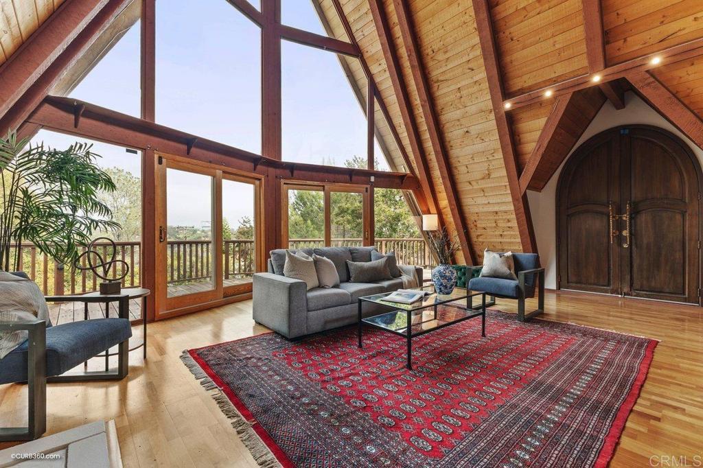 602 Sereno View Road Encinitas, CA 92024 - Photo 5 of 56 a living room with furniture a rug and a floor to ceiling window