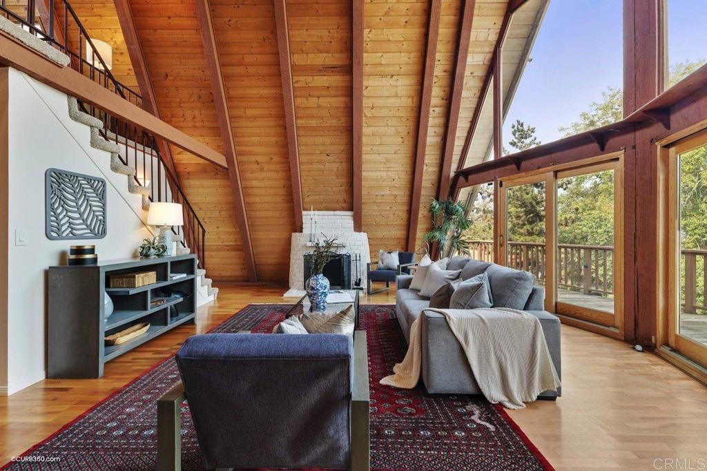 602 Sereno View Road Encinitas, CA 92024 - Photo 6 of 56 a living room with furniture and a floor to ceiling window