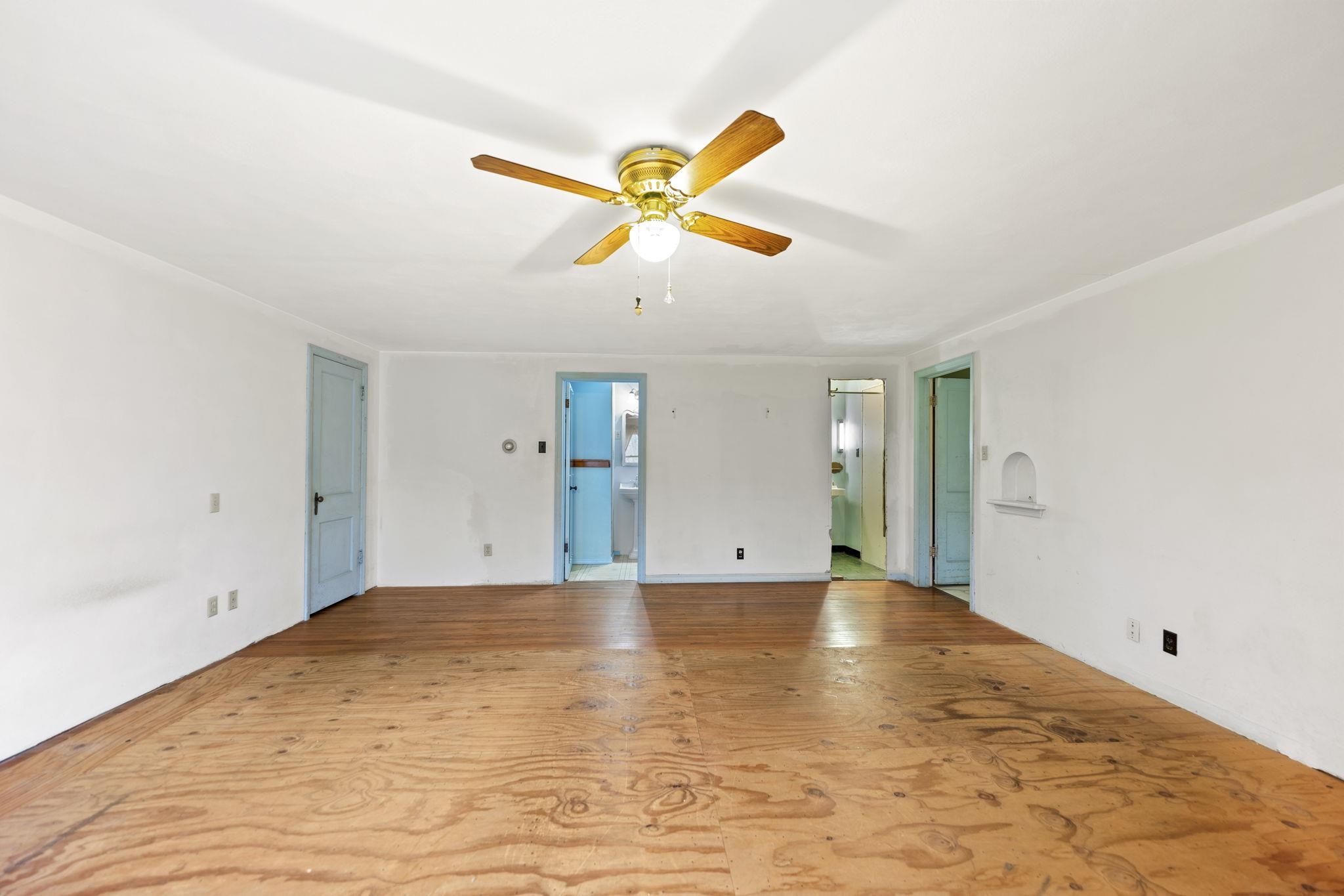 739 Elgin Street Cherry Valley, IL 61016 - Photo 12 of 41 a view of a big room with wooden floor and windows