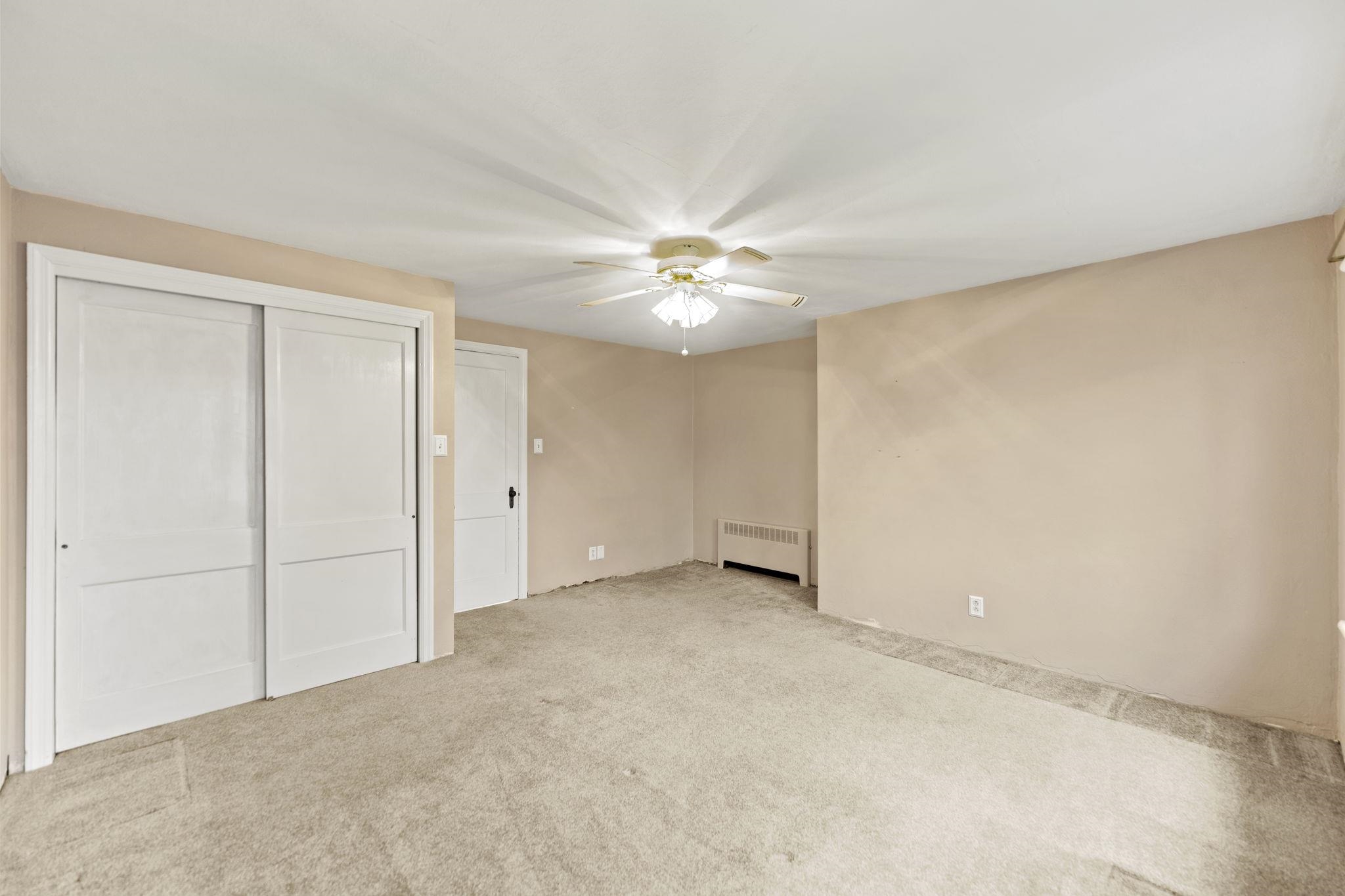 739 Elgin Street Cherry Valley, IL 61016 - Photo 16 of 41 a view of an empty room with a ceiling fan