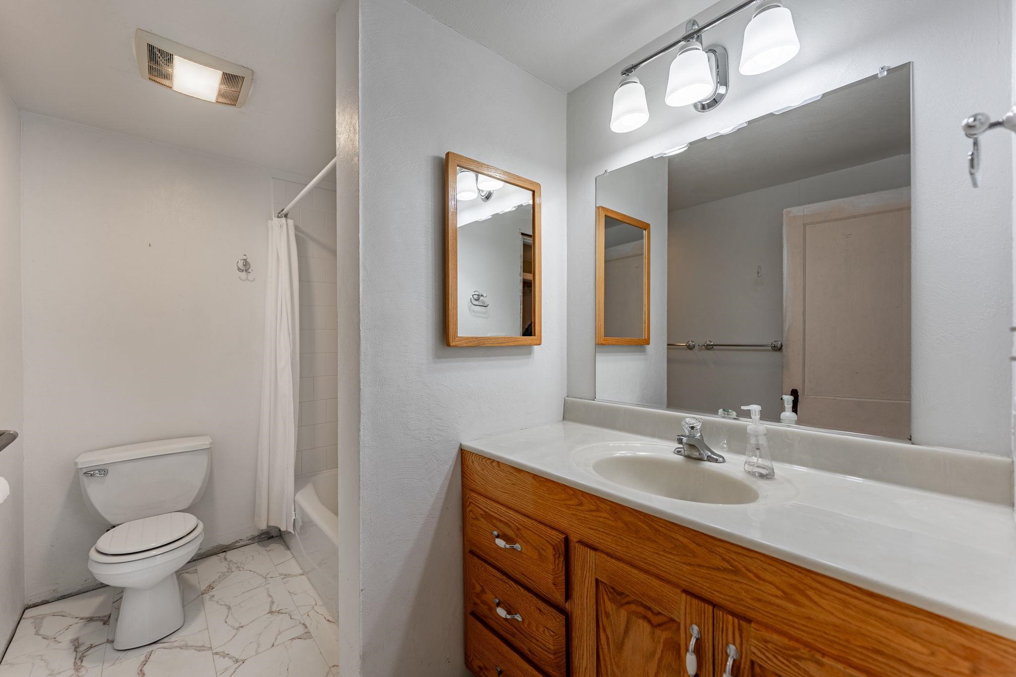 739 Elgin Street Cherry Valley, IL 61016 - Photo 17 of 41 a bathroom with a granite countertop sink mirror vanity and toilet