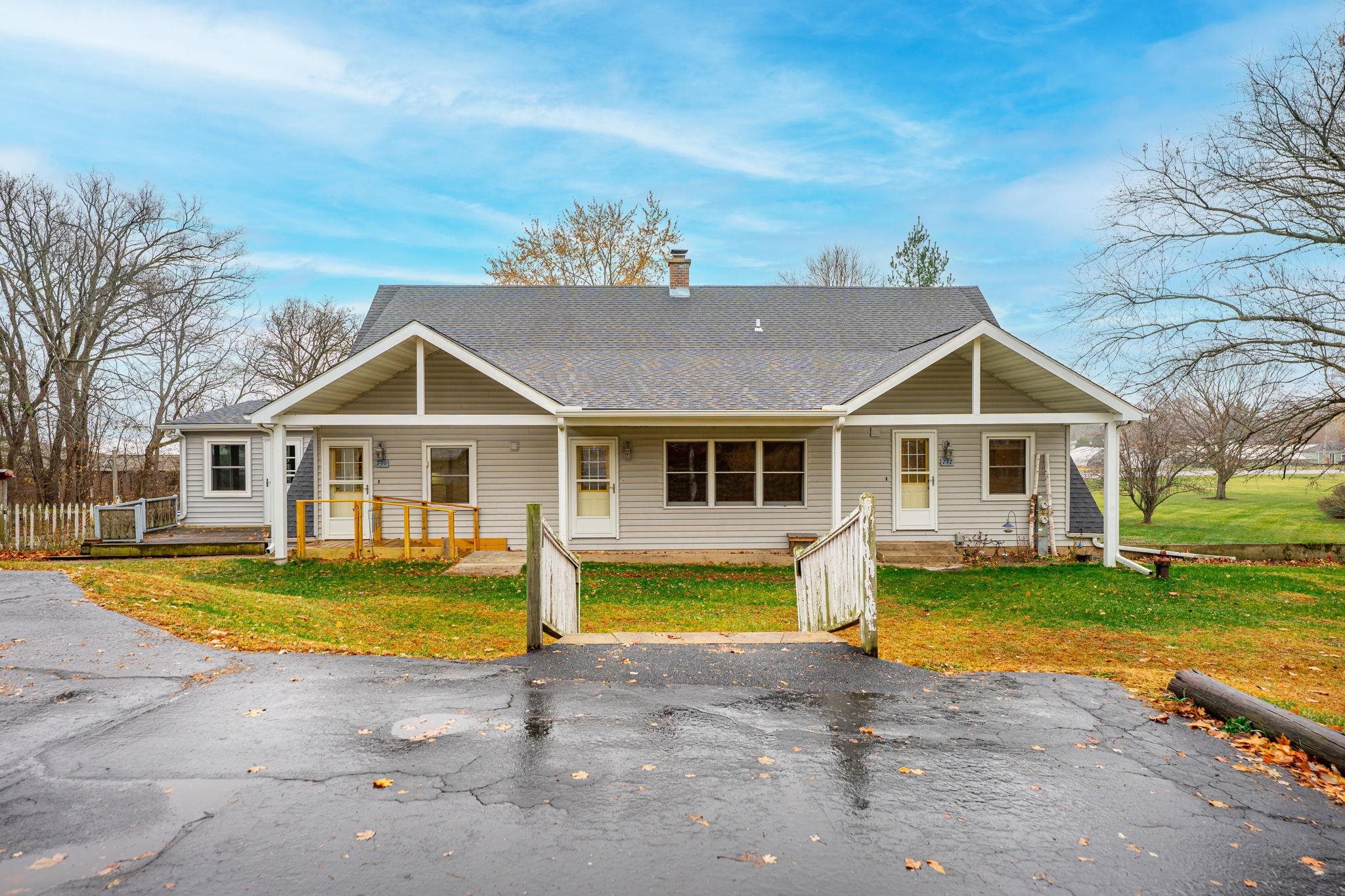 739 Elgin Street Cherry Valley, IL 61016 - Photo 2 of 41 a front view of a house with a yard and swimming pool