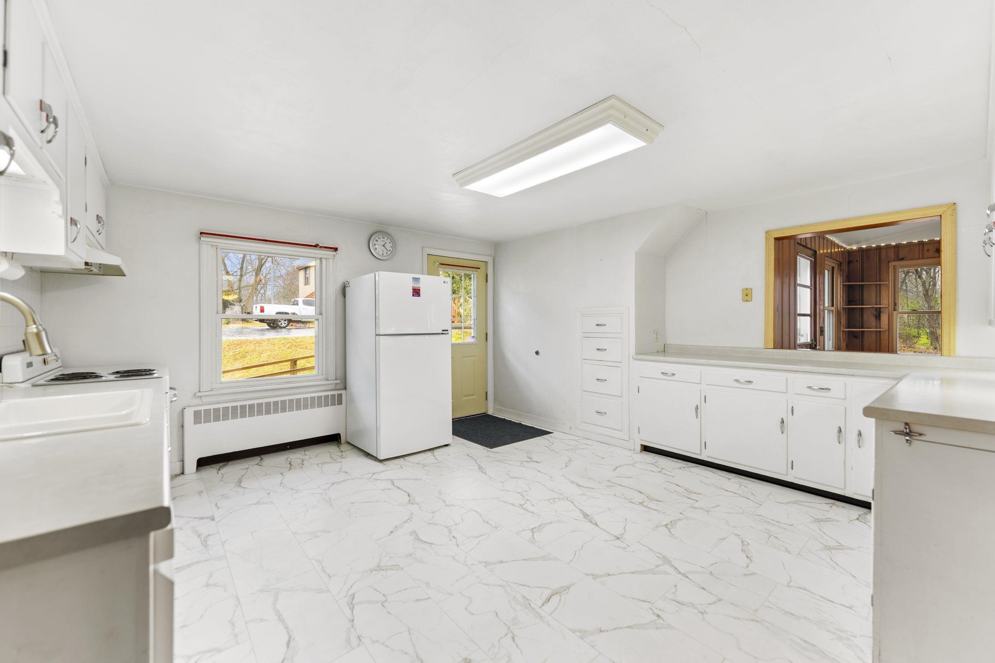 739 Elgin Street Cherry Valley, IL 61016 - Photo 6 of 41 a kitchen with cabinets and window