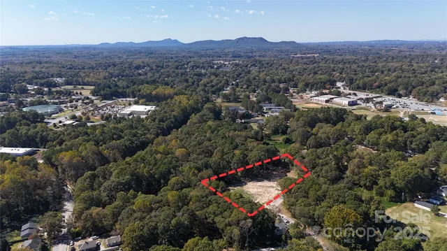 an aerial view of residential house and green space