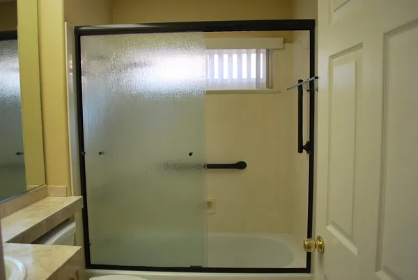 a view of a closet with wooden walls