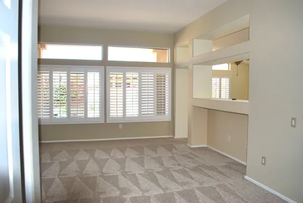 a view of an empty room with a window