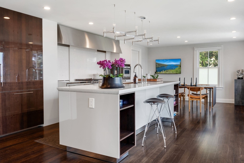 5 Redstone Lane Marblehead, MA 01945 - Photo 11 of 37 a kitchen with kitchen island a dining table chairs stainless steel appliances and cabinets