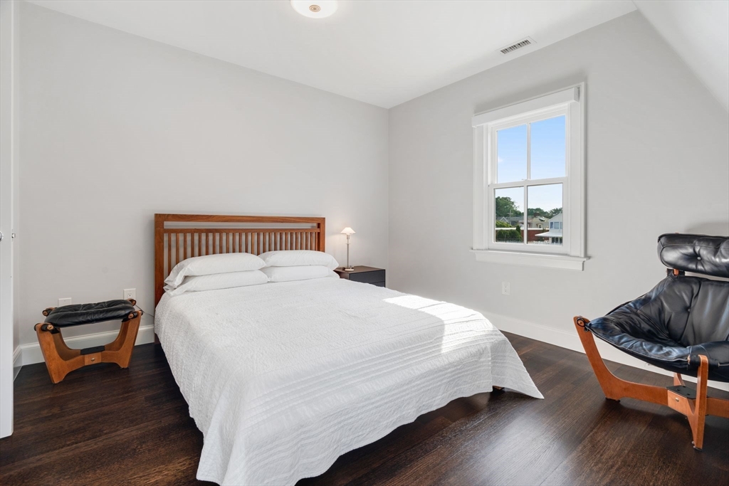 5 Redstone Lane Marblehead, MA 01945 - Photo 20 of 37 a bedroom with a bed and wooden floor