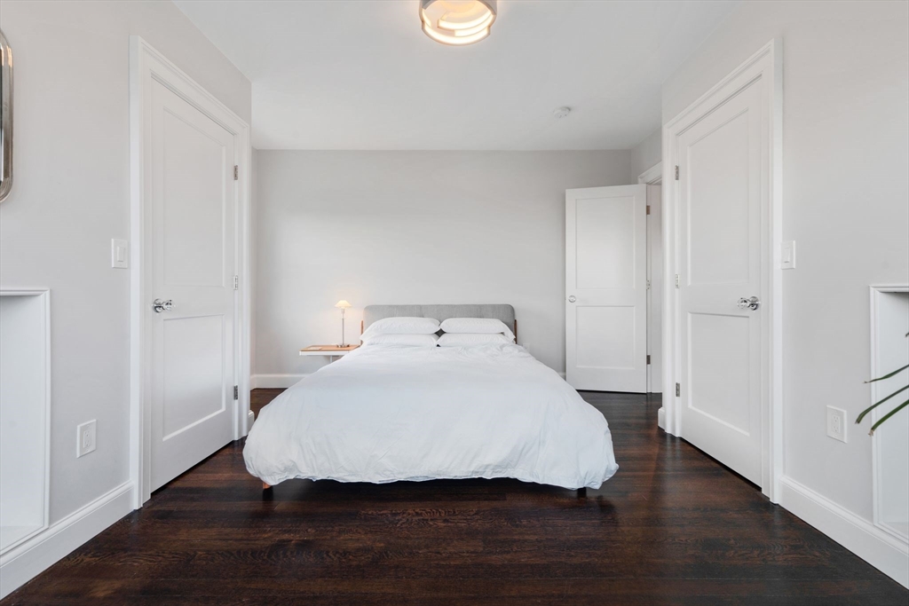 5 Redstone Lane Marblehead, MA 01945 - Photo 22 of 37 a bedroom with a bed and wooden floor