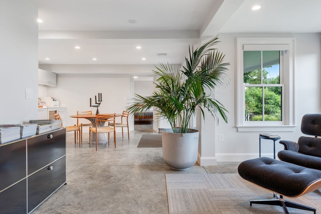 5 Redstone Lane Marblehead, MA 01945 - Photo 30 of 37 a living room with furniture a potted plant and a large window