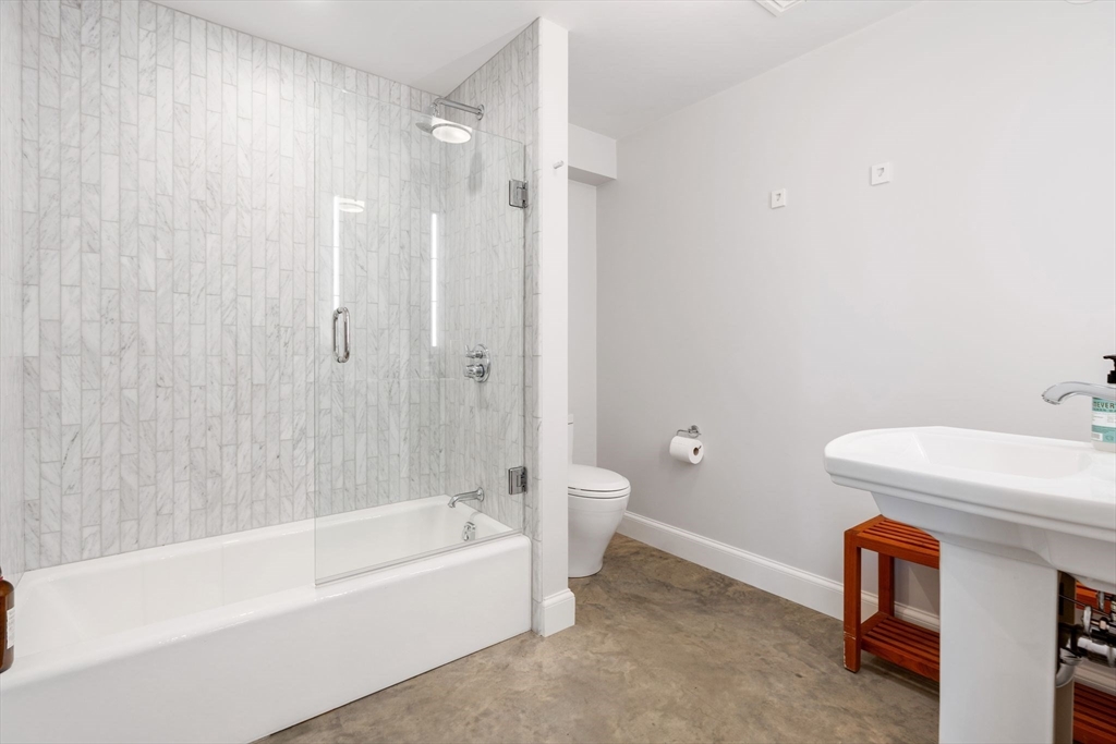 5 Redstone Lane Marblehead, MA 01945 - Photo 31 of 37 a bathroom with a bathtub a toilet and a sink