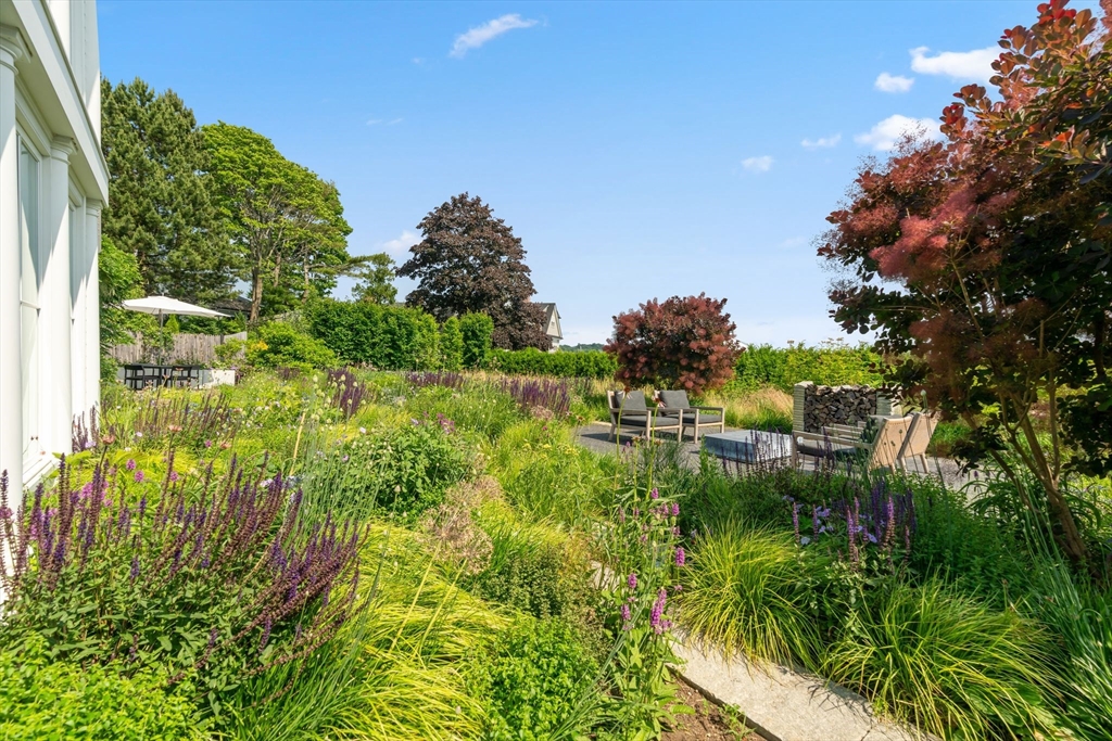 5 Redstone Lane Marblehead, MA 01945 - Photo 34 of 37 a view of a garden in a lake