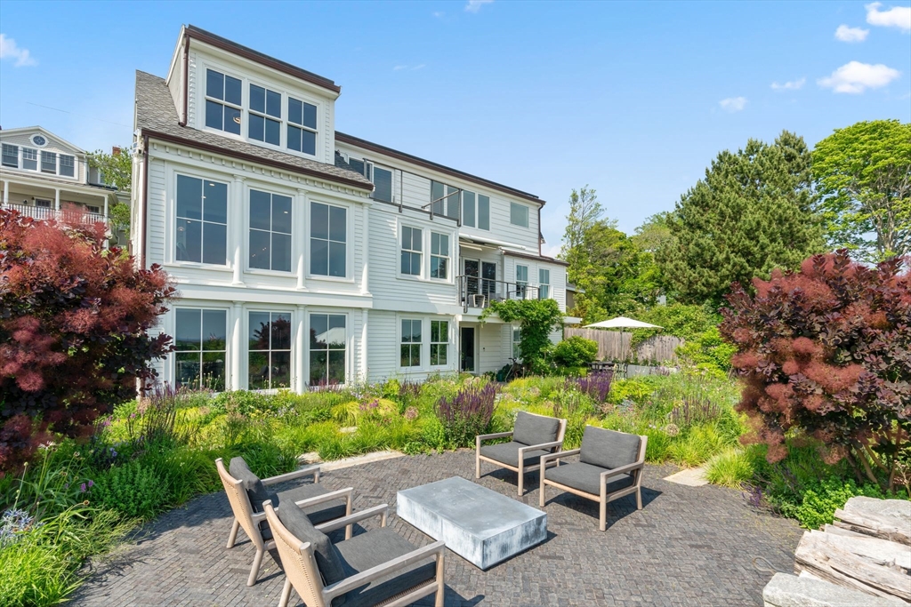 5 Redstone Lane Marblehead, MA 01945 - Photo 35 of 37 a view of a patio with table and chairs and potted plants