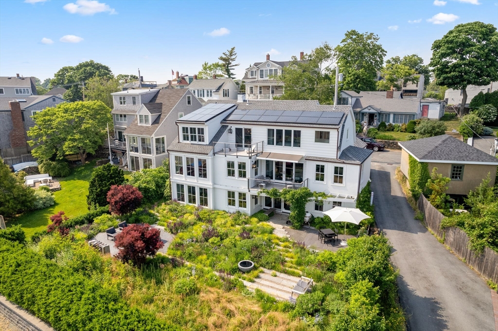 5 Redstone Lane Marblehead, MA 01945 - Photo 37 of 37 a front view of a multi story residential apartment building with yard and retail shops