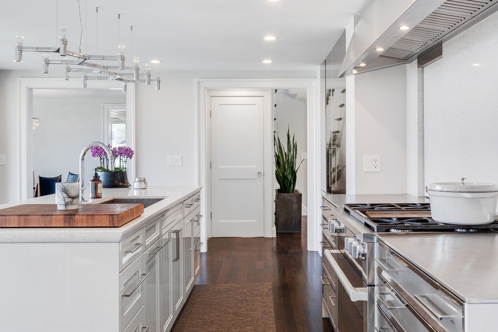 5 Redstone Lane Marblehead, MA 01945 - Photo 8 of 37 a kitchen with stainless steel appliances granite countertop a sink and a refrigerator
