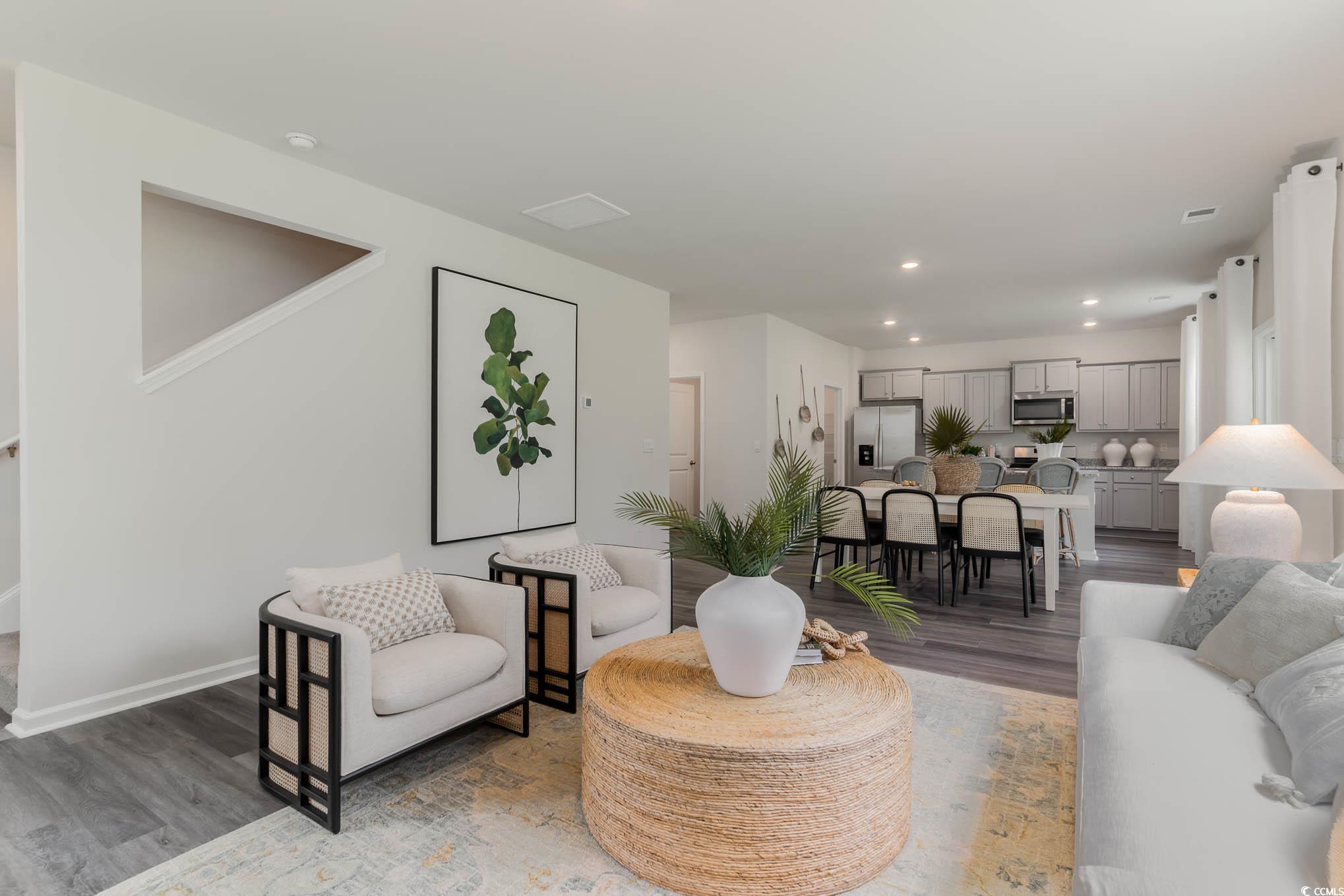 7431 Meadow Walk Loop Loris, SC 29569 - Photo 14 of 27 Living area with wood finished floors, recessed lighting, and baseboards