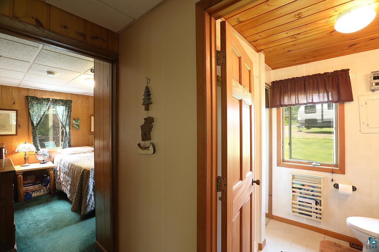 1198 West Mink Road Cotton, MN 55724 - Photo 12 of 23 Corridor featuring wood walls