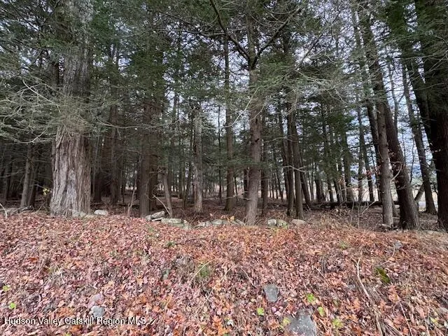 a wooden fence with trees in the background
