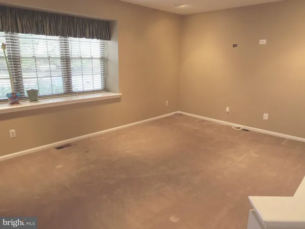 a view of a big room with wooden walls