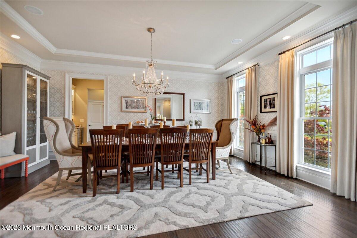 25 Windermere Road Lincroft, NJ 07738 - Photo 13 of 70 a view of a dining room with furniture window and wooden floor