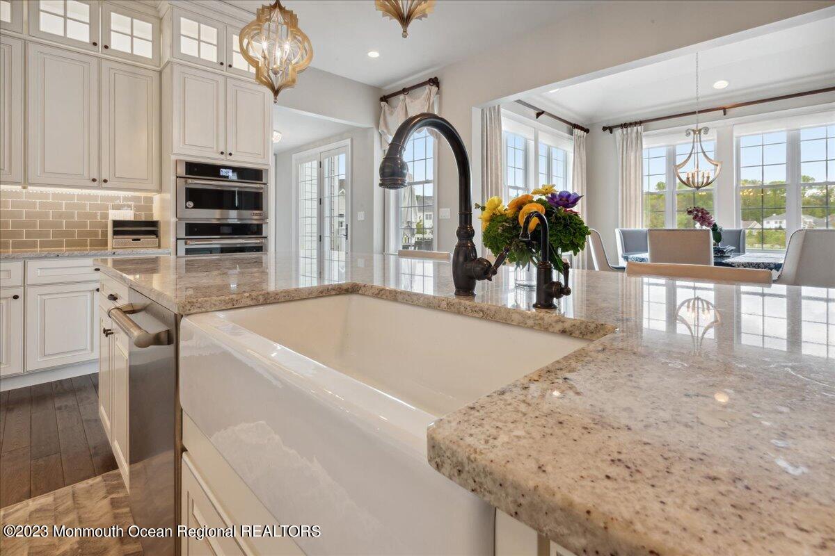 25 Windermere Road Lincroft, NJ 07738 - Photo 17 of 70 a view of living room kitchen with furniture and outdoor view