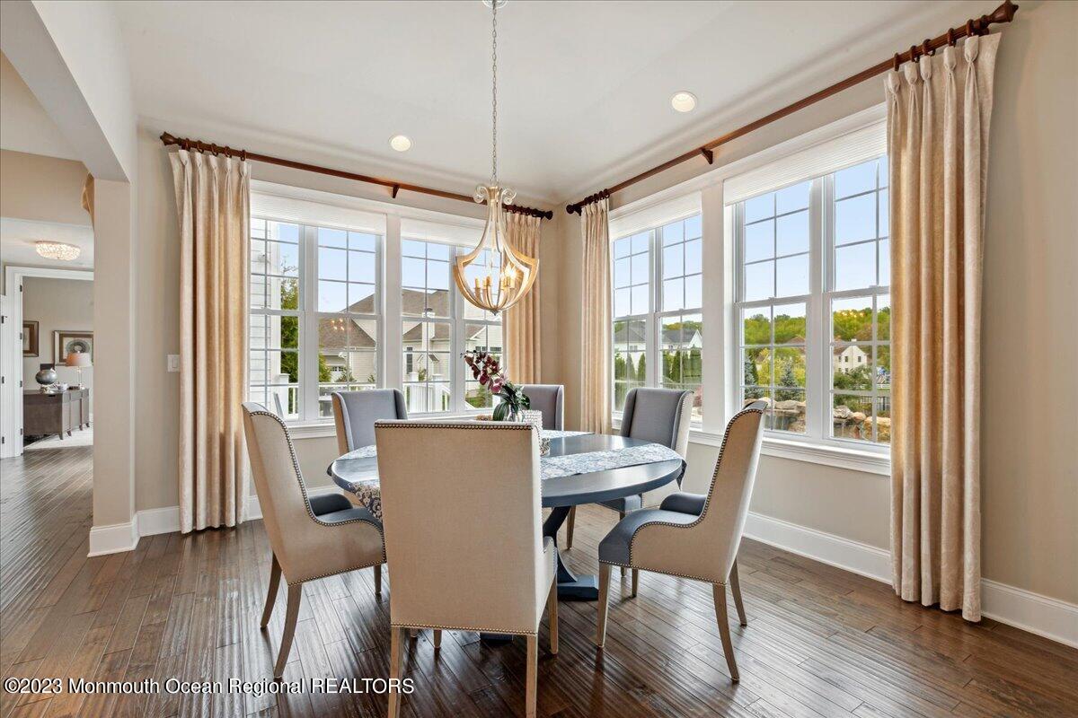 25 Windermere Road Lincroft, NJ 07738 - Photo 19 of 70 a view of a dining room with furniture window and wooden floor