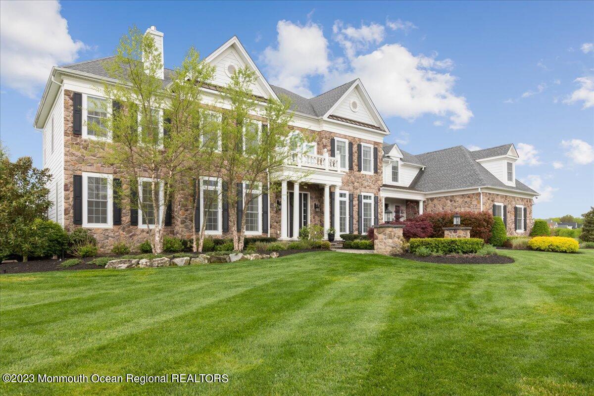 25 Windermere Road Lincroft, NJ 07738 - Photo 2 of 70 a front view of building with yard