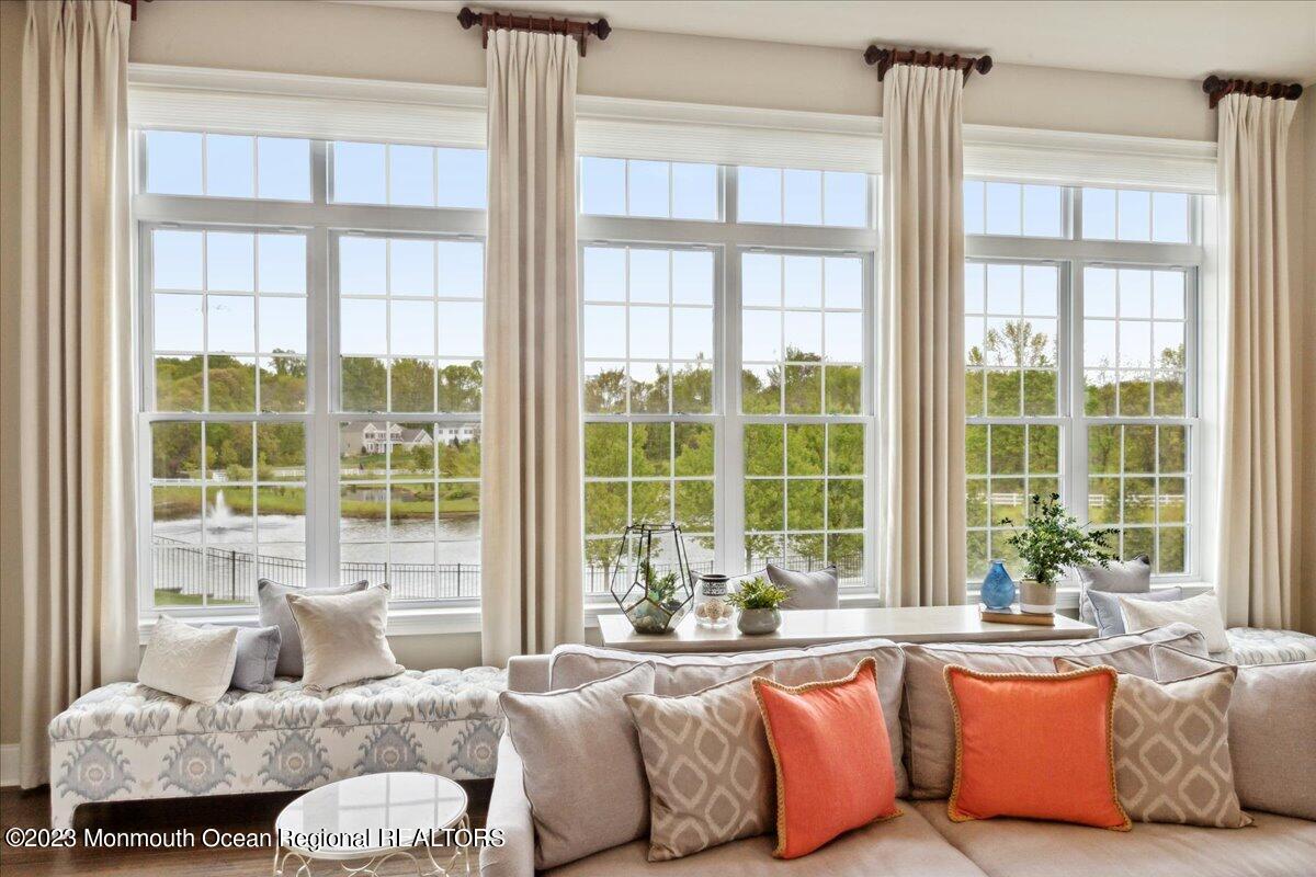 25 Windermere Road Lincroft, NJ 07738 - Photo 22 of 70 a living room with couches and a large window