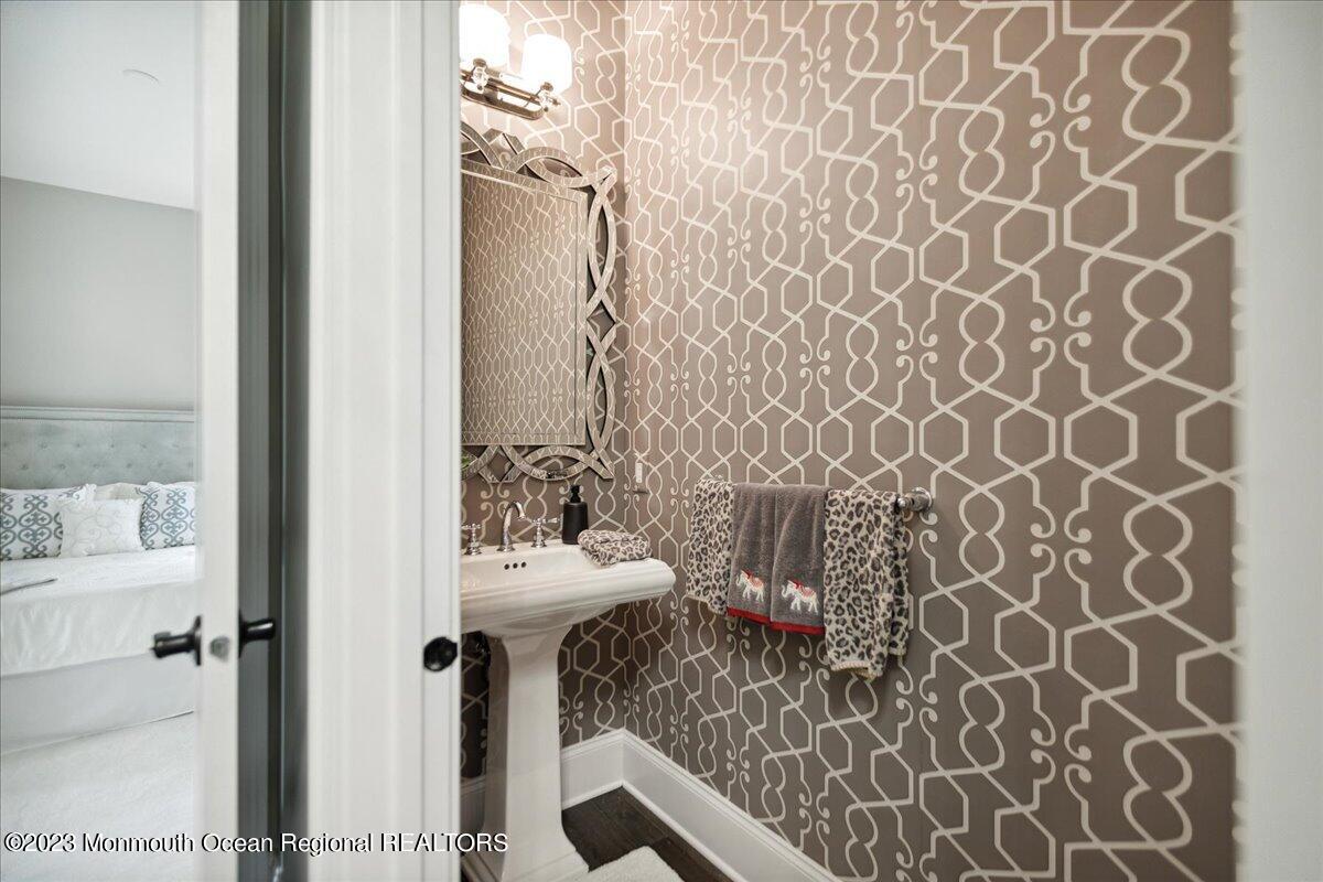 25 Windermere Road Lincroft, NJ 07738 - Photo 26 of 70 a bathroom with a sink and mirror with toilet