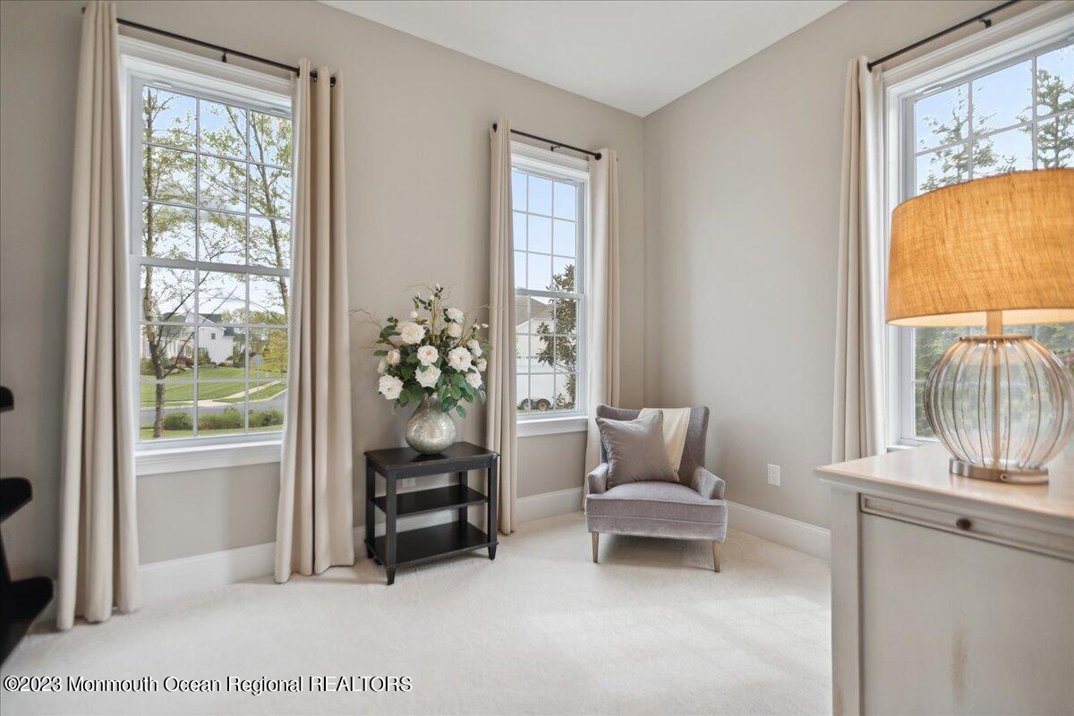 25 Windermere Road Lincroft, NJ 07738 - Photo 28 of 70 a living room with furniture and a window