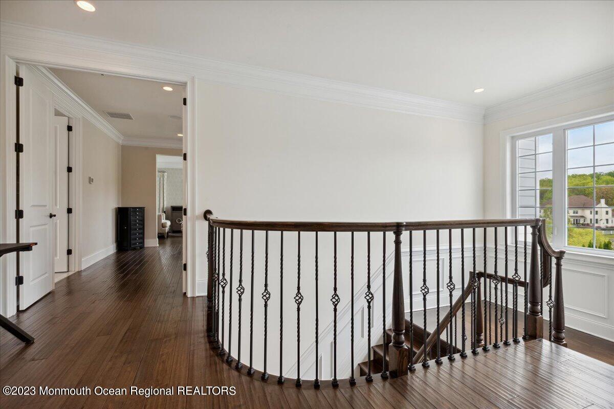 25 Windermere Road Lincroft, NJ 07738 - Photo 31 of 70 a view of a hallway with wooden floor and windows