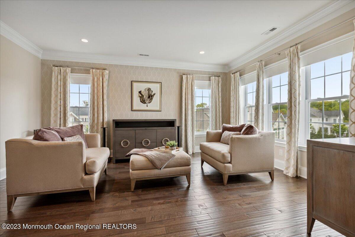 25 Windermere Road Lincroft, NJ 07738 - Photo 34 of 70 a living room with furniture and large windows