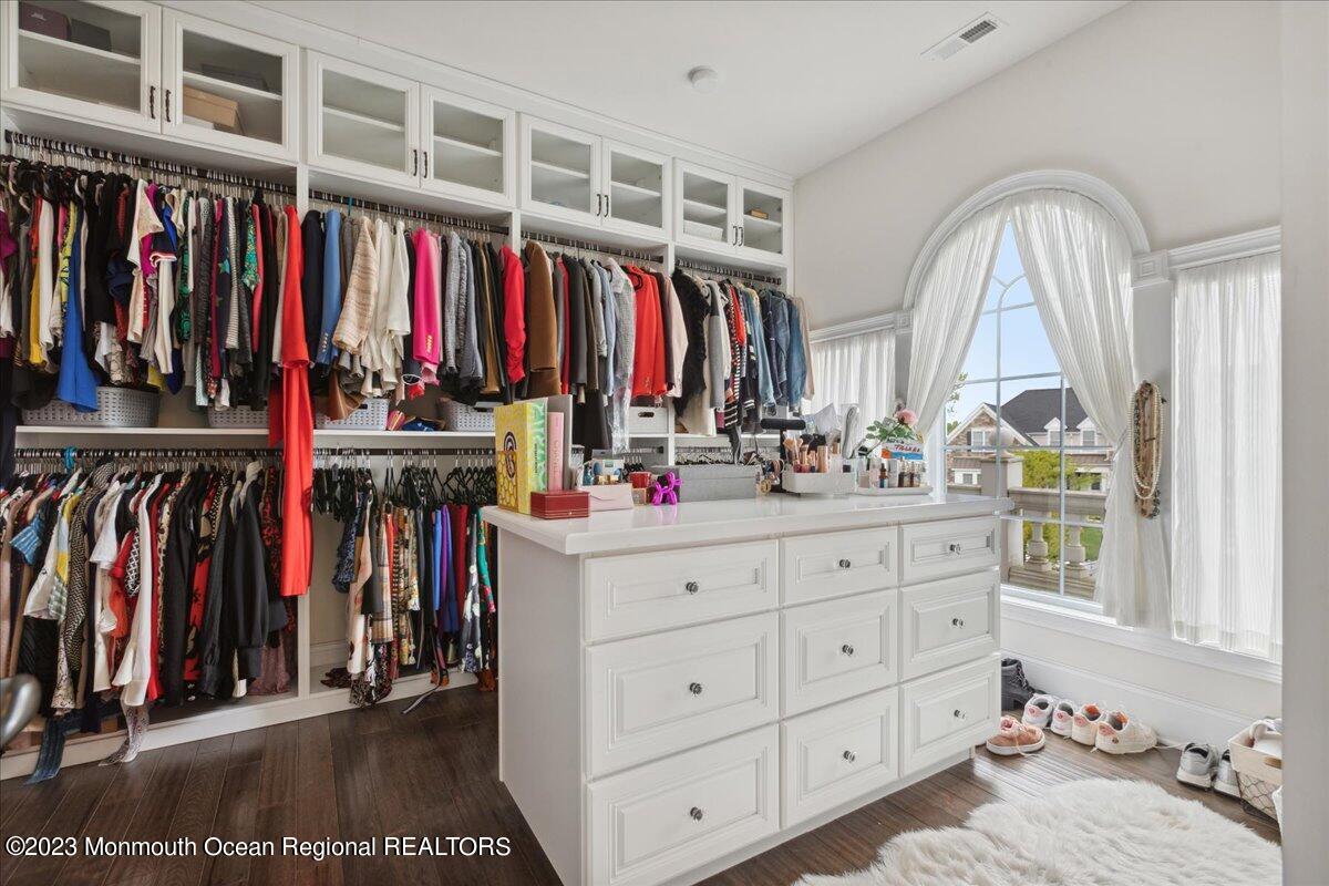 25 Windermere Road Lincroft, NJ 07738 - Photo 39 of 70 a view of walk in closet with clothes