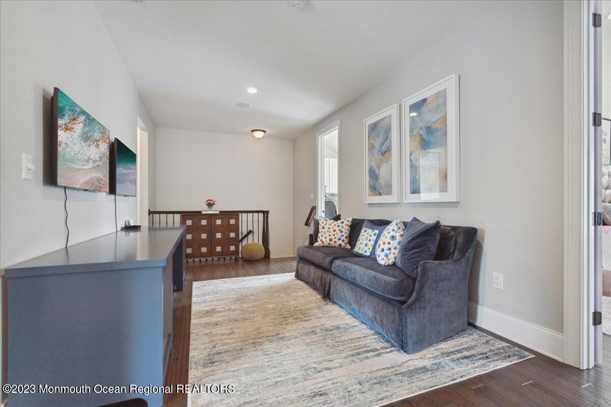 25 Windermere Road Lincroft, NJ 07738 - Photo 40 of 70 a living room with furniture and a flat screen tv