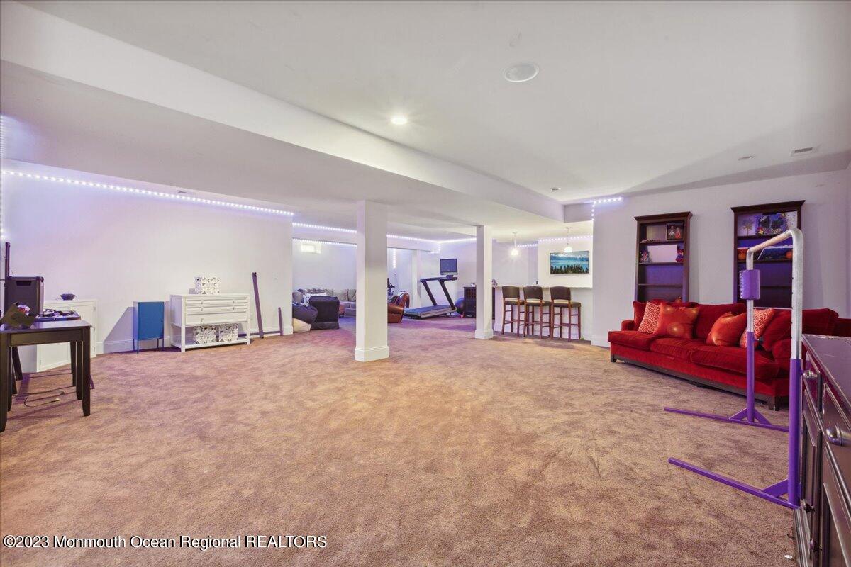 25 Windermere Road Lincroft, NJ 07738 - Photo 48 of 70 a large bedroom with a large bed and a closet