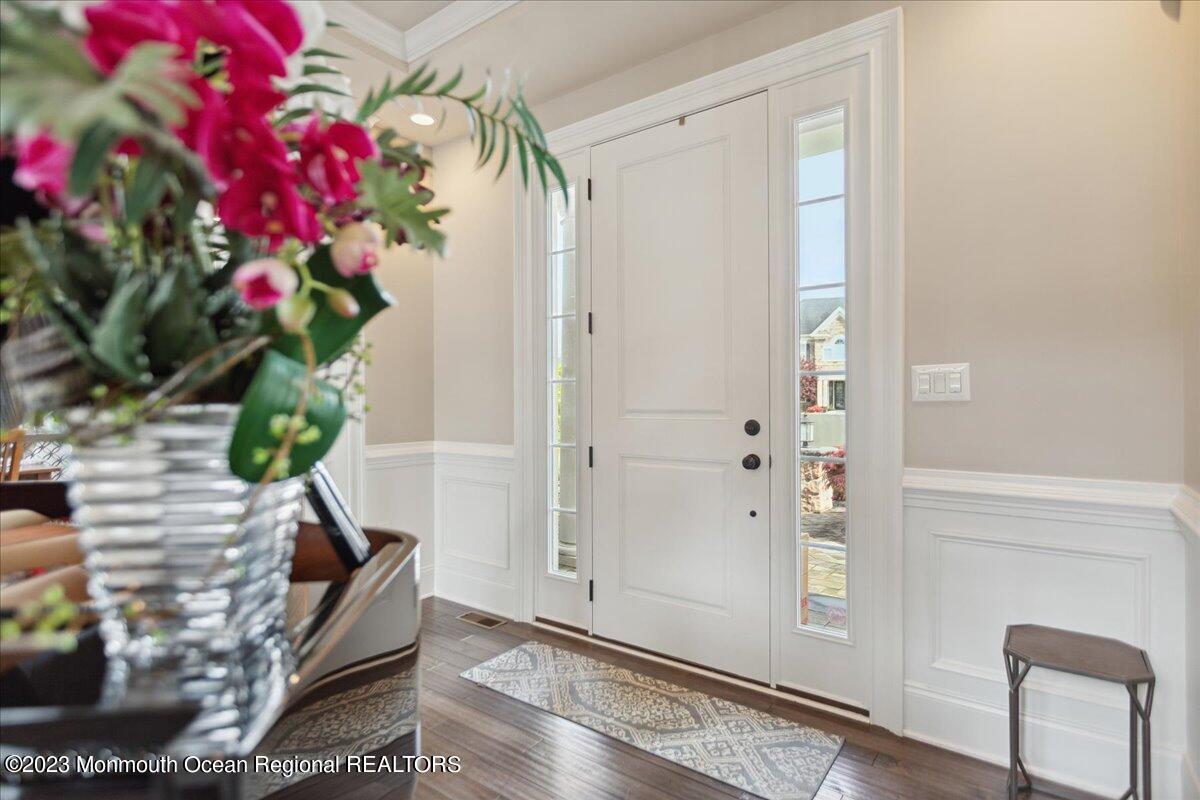 25 Windermere Road Lincroft, NJ 07738 - Photo 5 of 70 a vase of flowers sitting on a floor