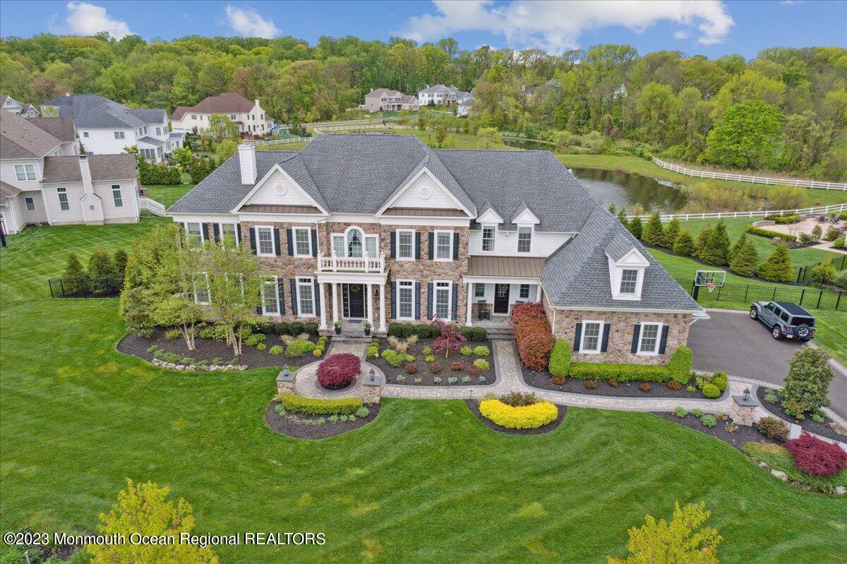 25 Windermere Road Lincroft, NJ 07738 - Photo 62 of 70 a aerial view of a house with swimming pool and big yard