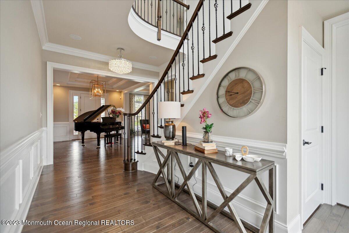 25 Windermere Road Lincroft, NJ 07738 - Photo 9 of 70 a view of entryway and hall with wooden floor